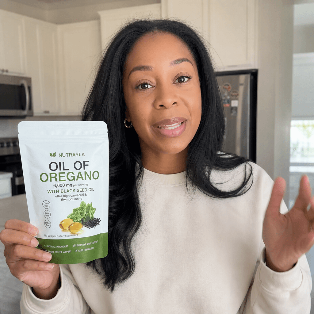 Home vlog frame talking while holding a NUTRAYLA oregano pouch